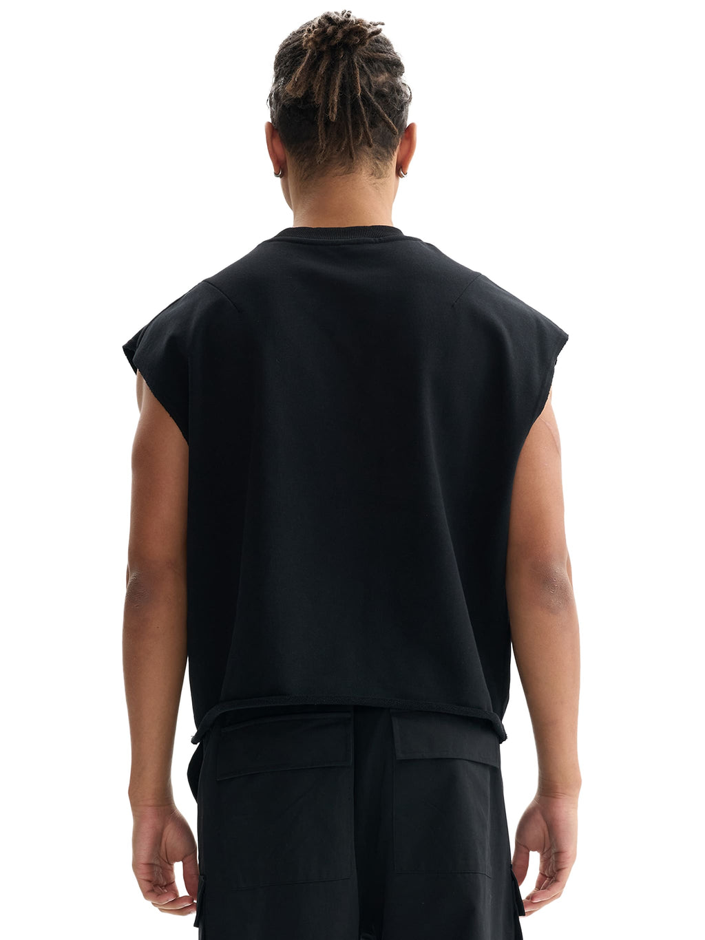 Person wearing a black sleeveless shirt on a white background