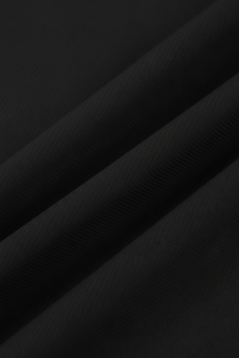 Close-up of black fabric with a ribbed texture